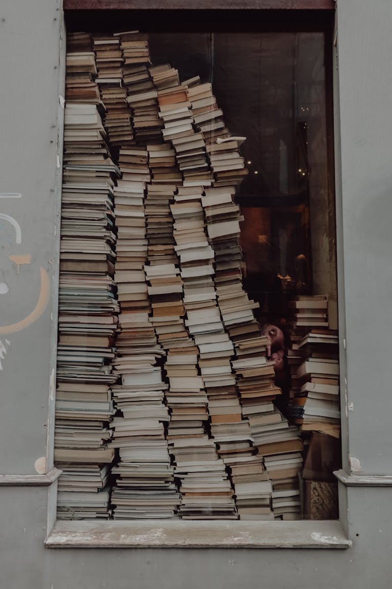 Stacks of Books by the Window